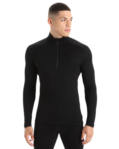 Black Coloured Icebreaker Mens Merino 260 Tech Half Zip Thermal Top on white background 