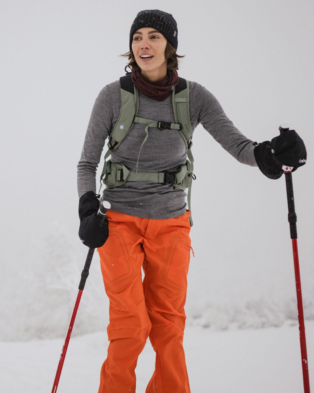 Gritstone Heather Coloured Icebreaker Womens Merino 200 Oasis Crewe Thermal Top on snow background 