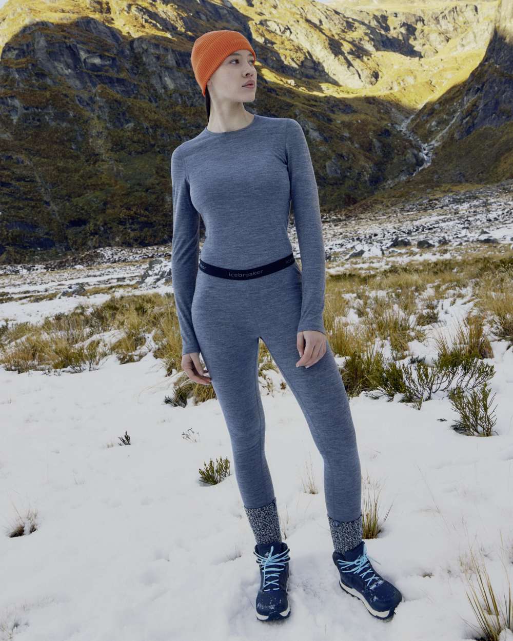 Gritstone Heather Coloured Icebreaker Womens Merino 200 Oasis Crewe Thermal Top on mountain background 