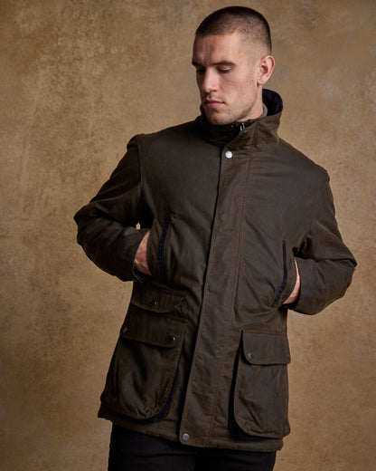 Olive Coloured Jack Murphy Archie Wax Jacket on indoor background 