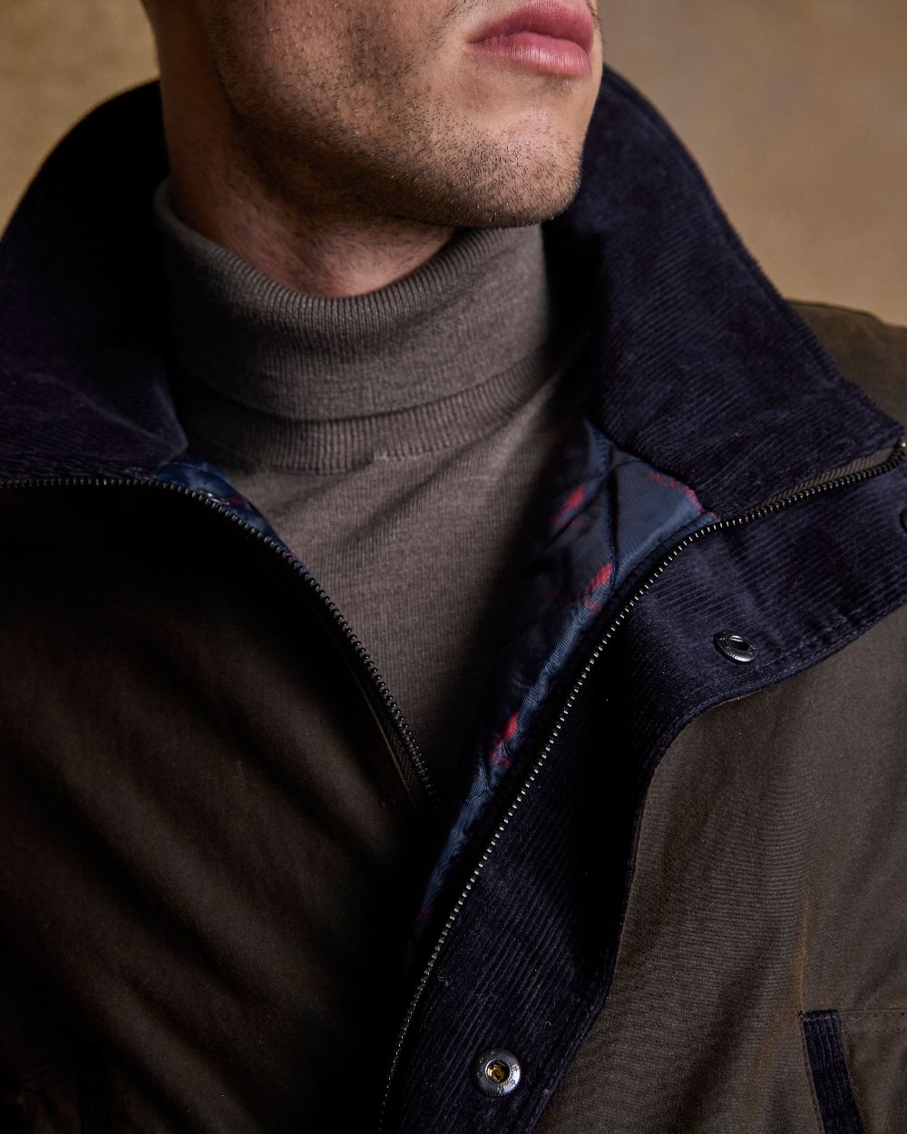 Olive Coloured Jack Murphy Archie Wax Jacket on indoor background 