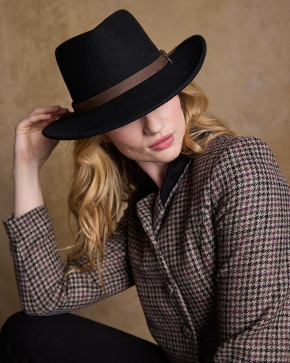 Black Coloured Jack Murphy Boston Crushable Felt Hat on indoor background 