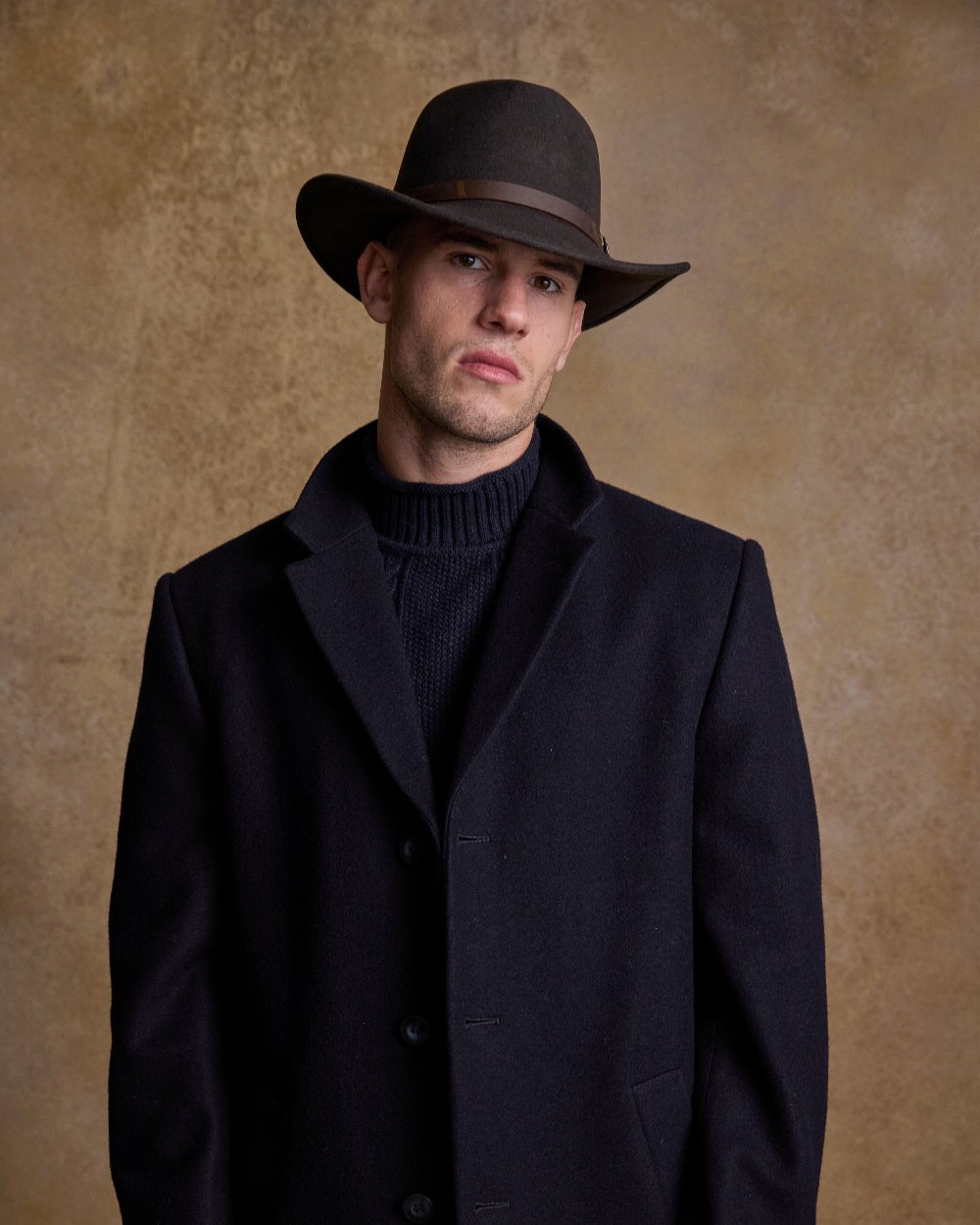 Brown Coloured Jack Murphy Boston Crushable Felt Hat on indoor background 