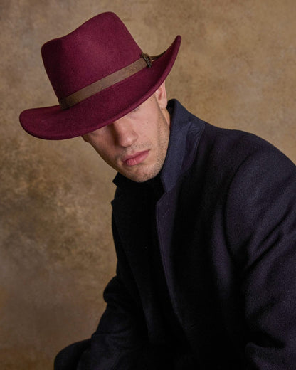 Burgundy Coloured Jack Murphy Boston Crushable Felt Hat on indoor background 