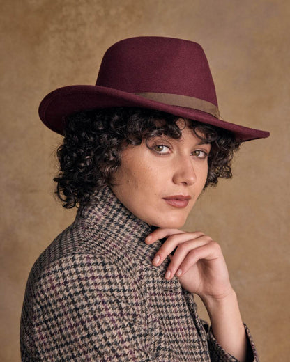 Burgundy Coloured Jack Murphy Boston Crushable Felt Hat on indoor background 