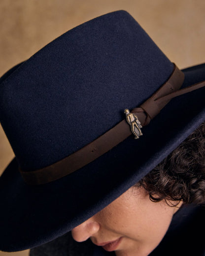 Navy Coloured Jack Murphy Boston Crushable Felt Hat on indoor background 