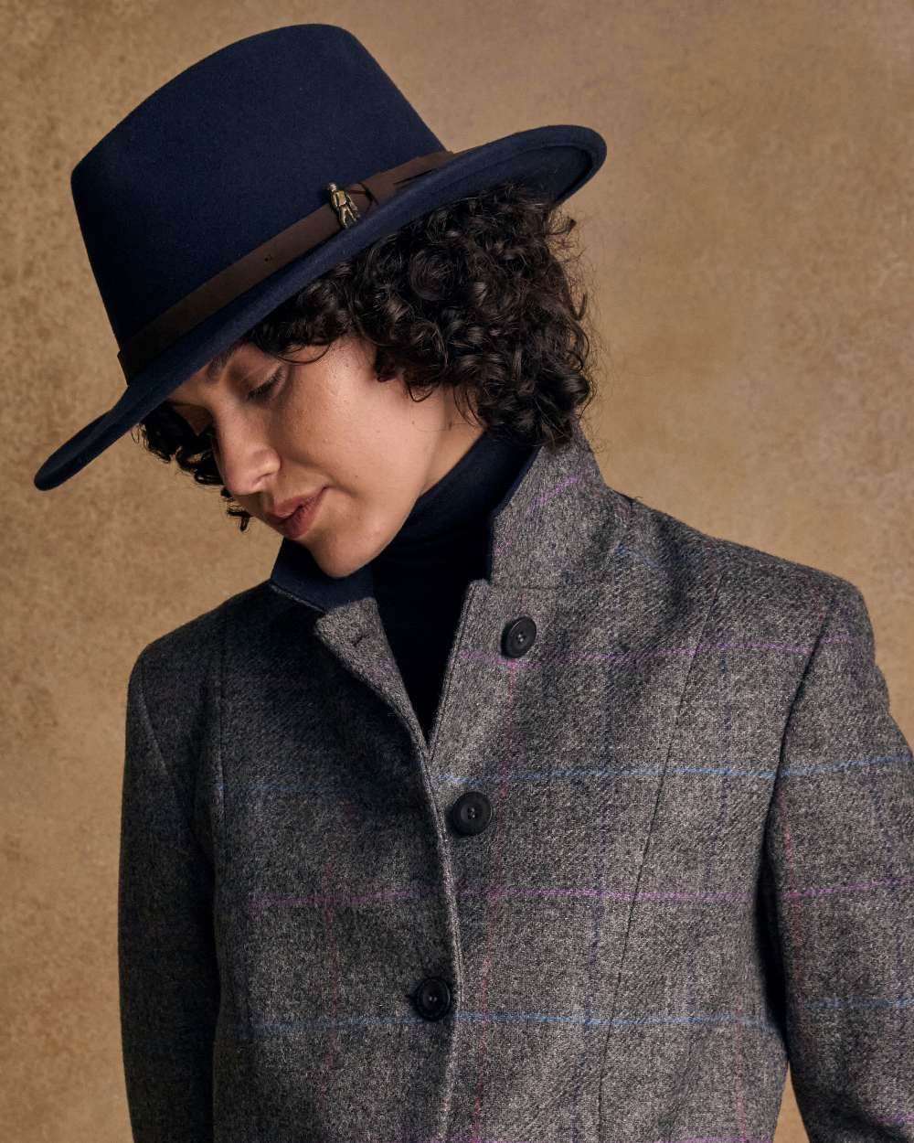 Navy Coloured Jack Murphy Boston Crushable Felt Hat on indoor background 