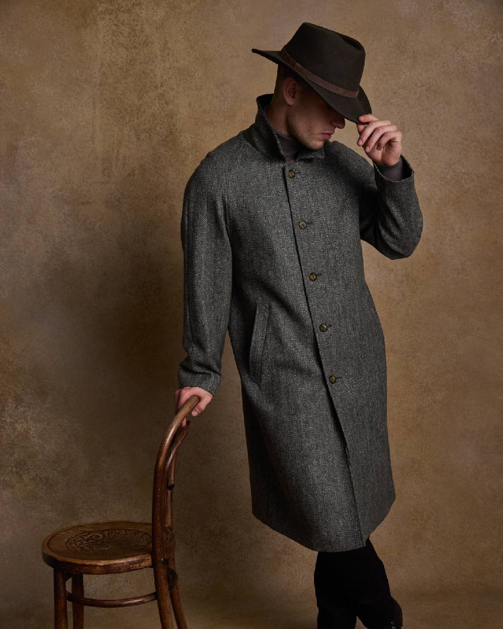 Olive Coloured Jack Murphy Boston Crushable Felt Hat on indoor background 