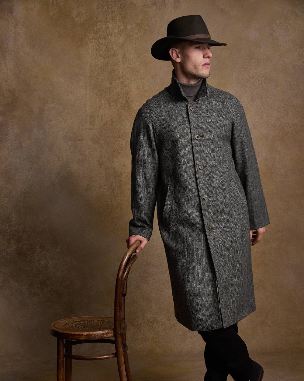 Olive Coloured Jack Murphy Boston Crushable Felt Hat on indoor background 