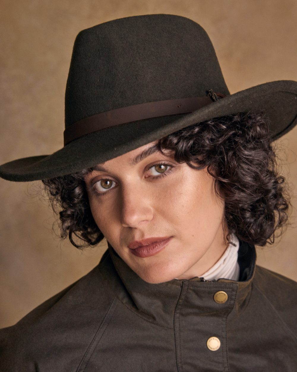 Olive Coloured Jack Murphy Boston Crushable Felt Hat on indoor background 