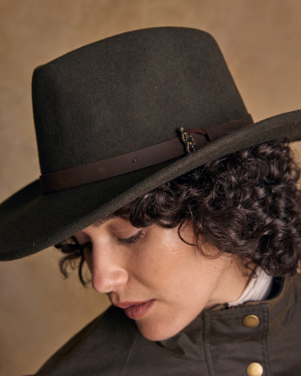 Olive Coloured Jack Murphy Boston Crushable Felt Hat on indoor background 