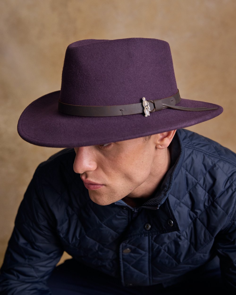 Plum Coloured Jack Murphy Boston Crushable Felt Hat on indoor background 
