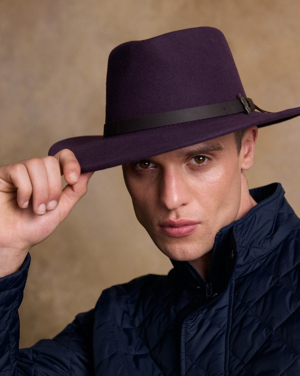 Plum Coloured Jack Murphy Boston Crushable Felt Hat on indoor background 