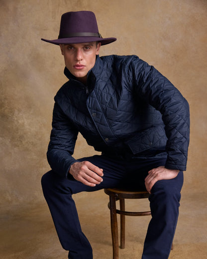 Plum Coloured Jack Murphy Boston Crushable Felt Hat on indoor background 