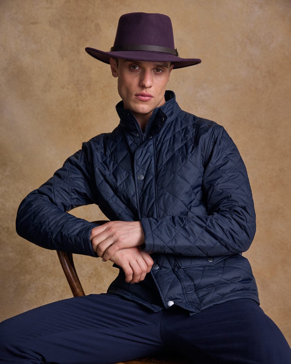 Plum Coloured Jack Murphy Boston Crushable Felt Hat on indoor background 