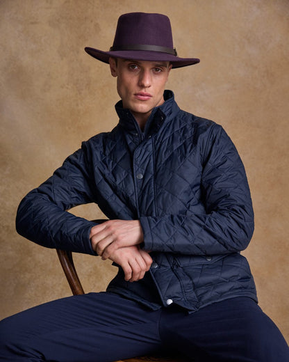 Plum Coloured Jack Murphy Boston Crushable Felt Hat on indoor background 