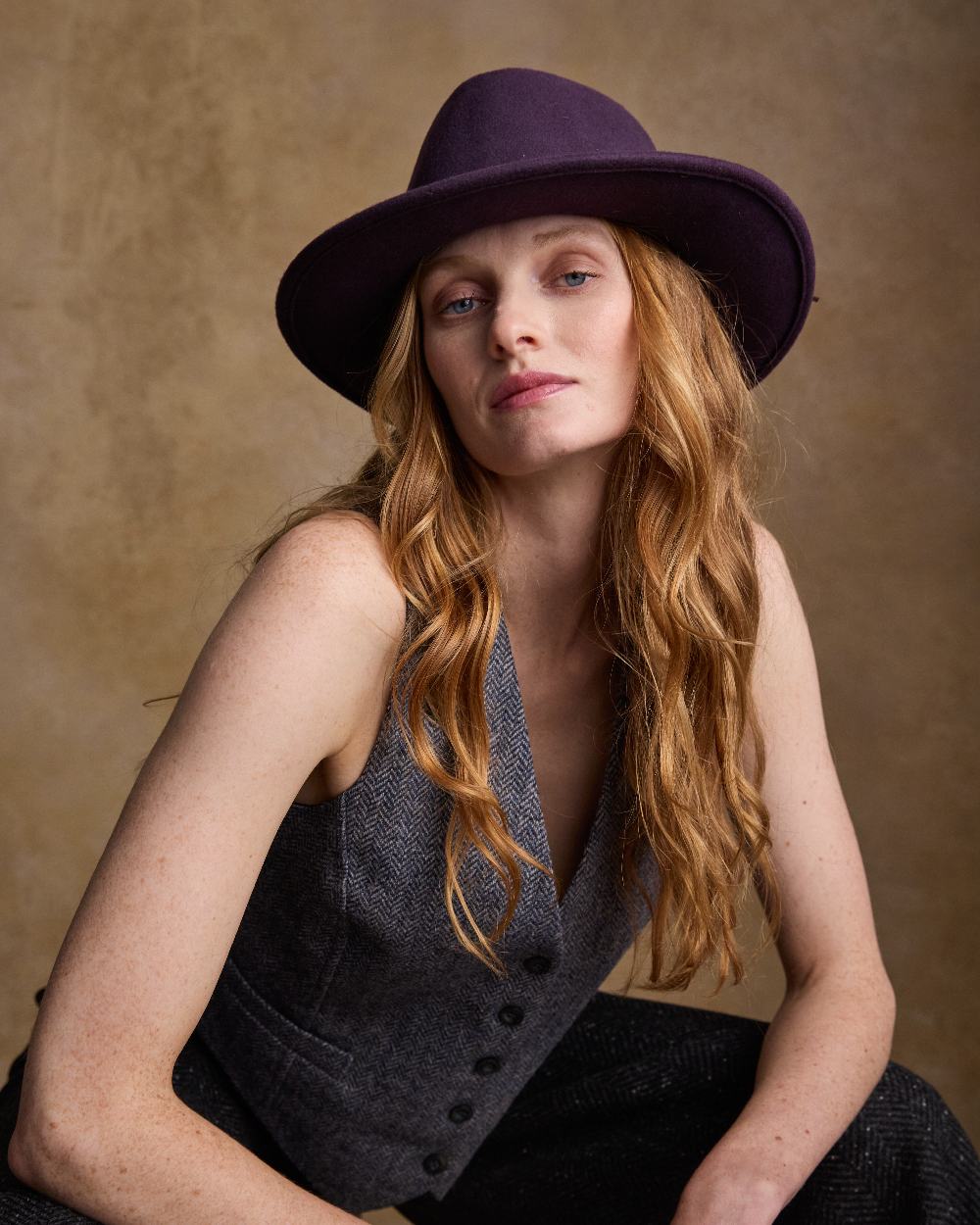 Plum Coloured Jack Murphy Boston Crushable Felt Hat on indoor background 