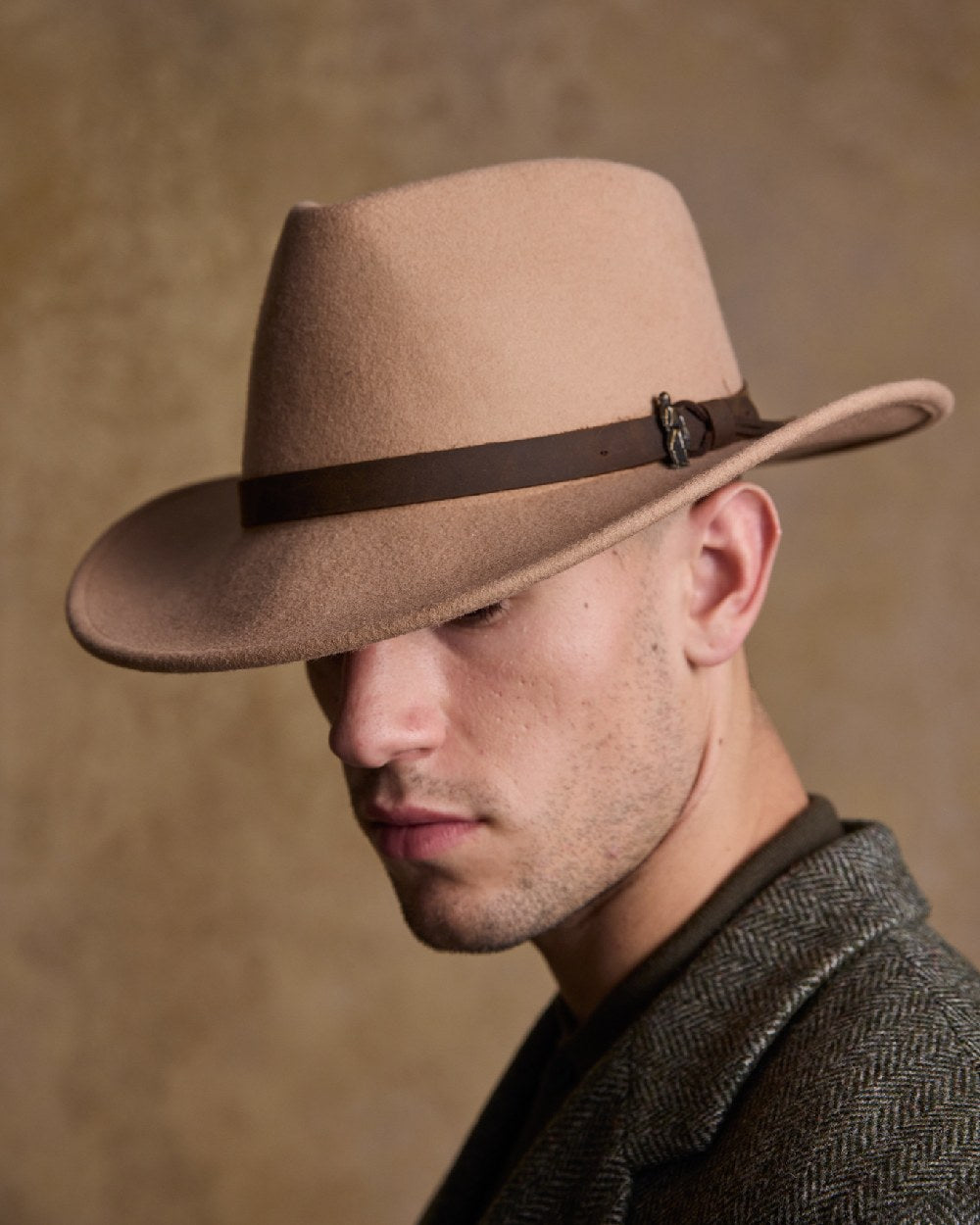 Tan Coloured Jack Murphy Boston Crushable Felt Hat on indoor background 
