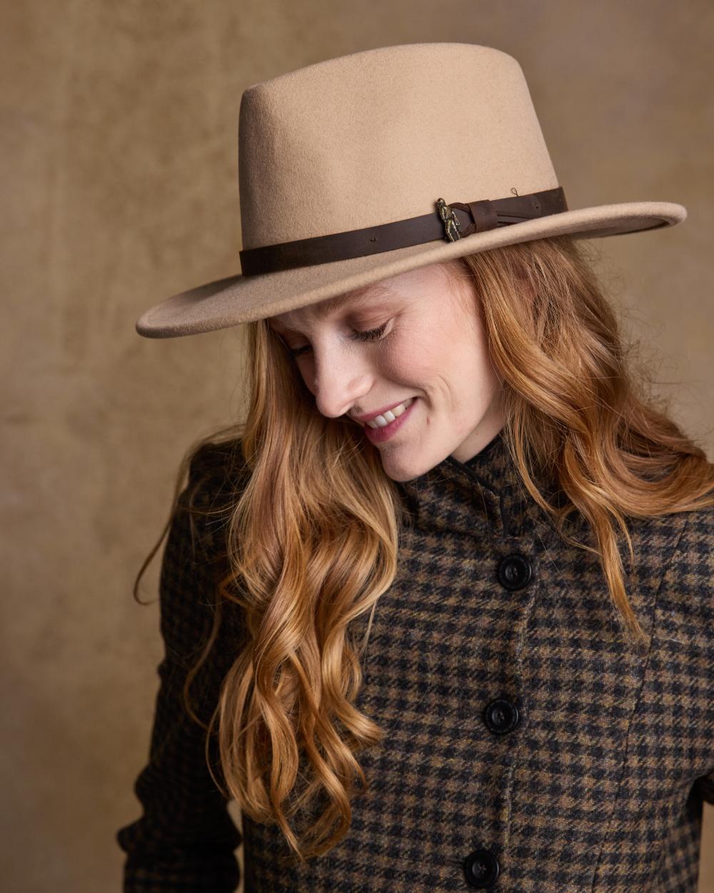 Tan Coloured Jack Murphy Boston Crushable Felt Hat on indoor background 