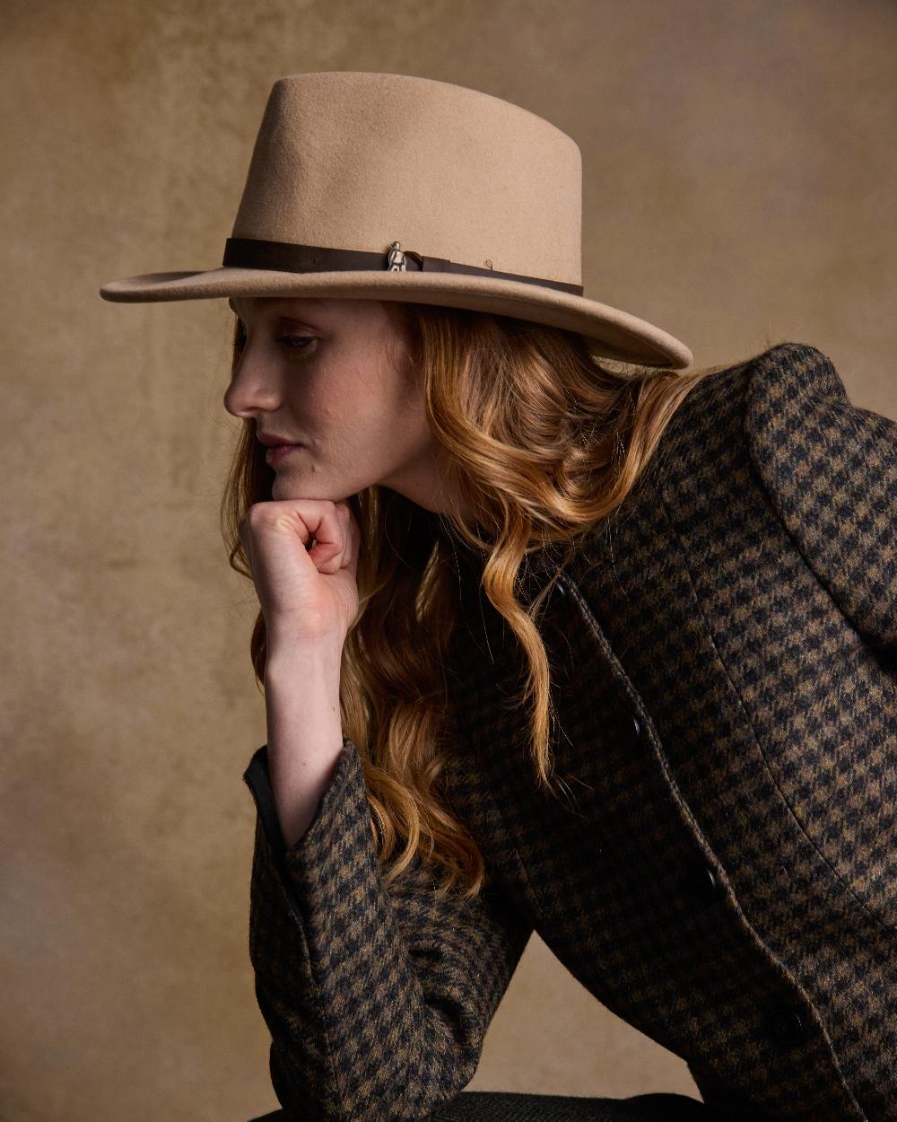 Tan Coloured Jack Murphy Boston Crushable Felt Hat on indoor background 