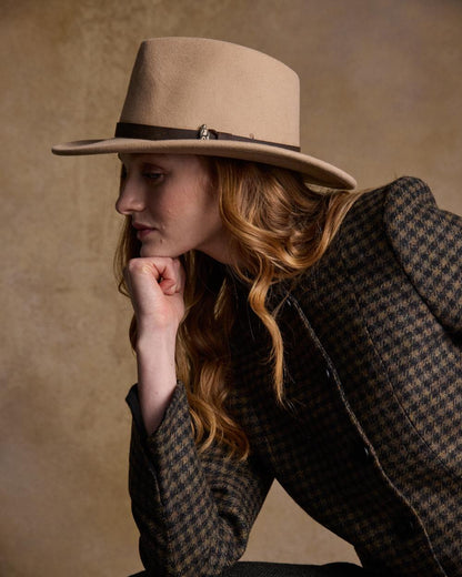 Tan Coloured Jack Murphy Boston Crushable Felt Hat on indoor background 