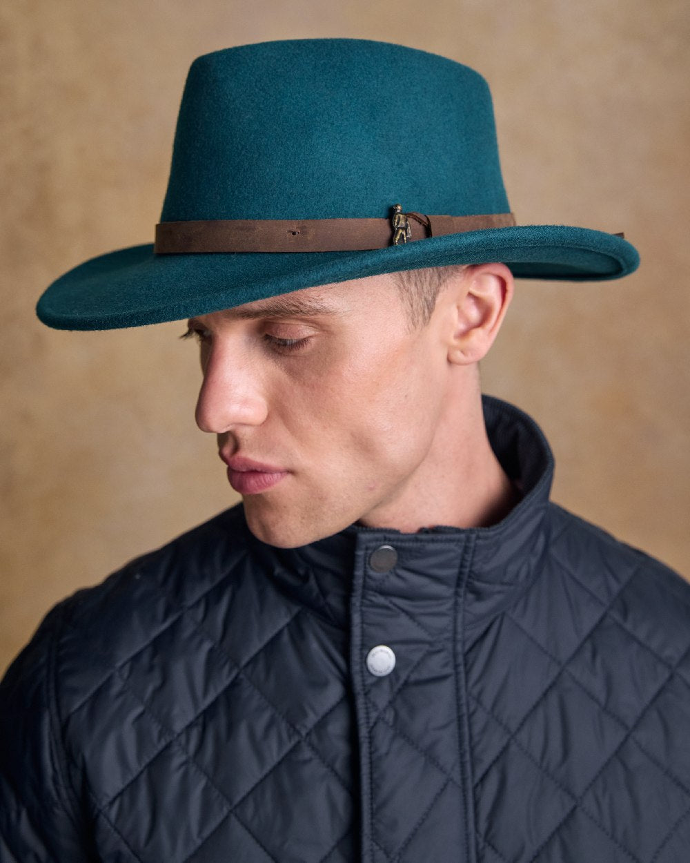 Teal Green Coloured Jack Murphy Boston Crushable Felt Hat on indoor background 