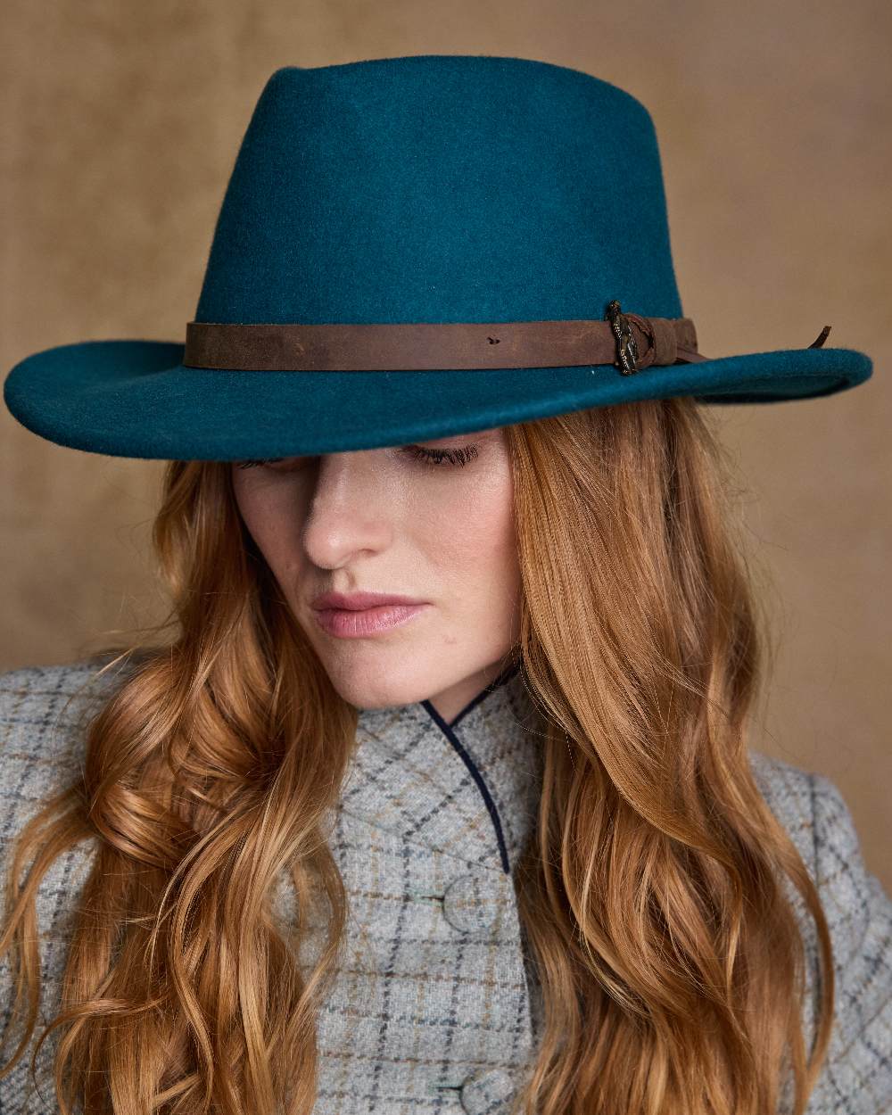 Teal Green Coloured Jack Murphy Boston Crushable Felt Hat on indoor background 