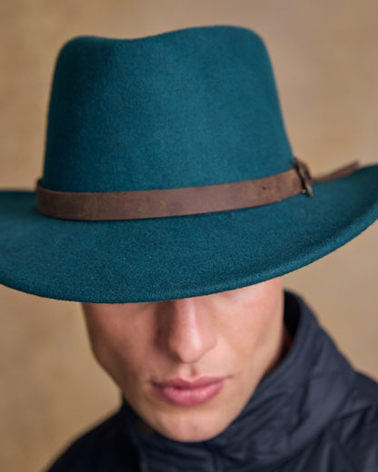 Teal Green Coloured Jack Murphy Boston Crushable Felt Hat on indoor background 
