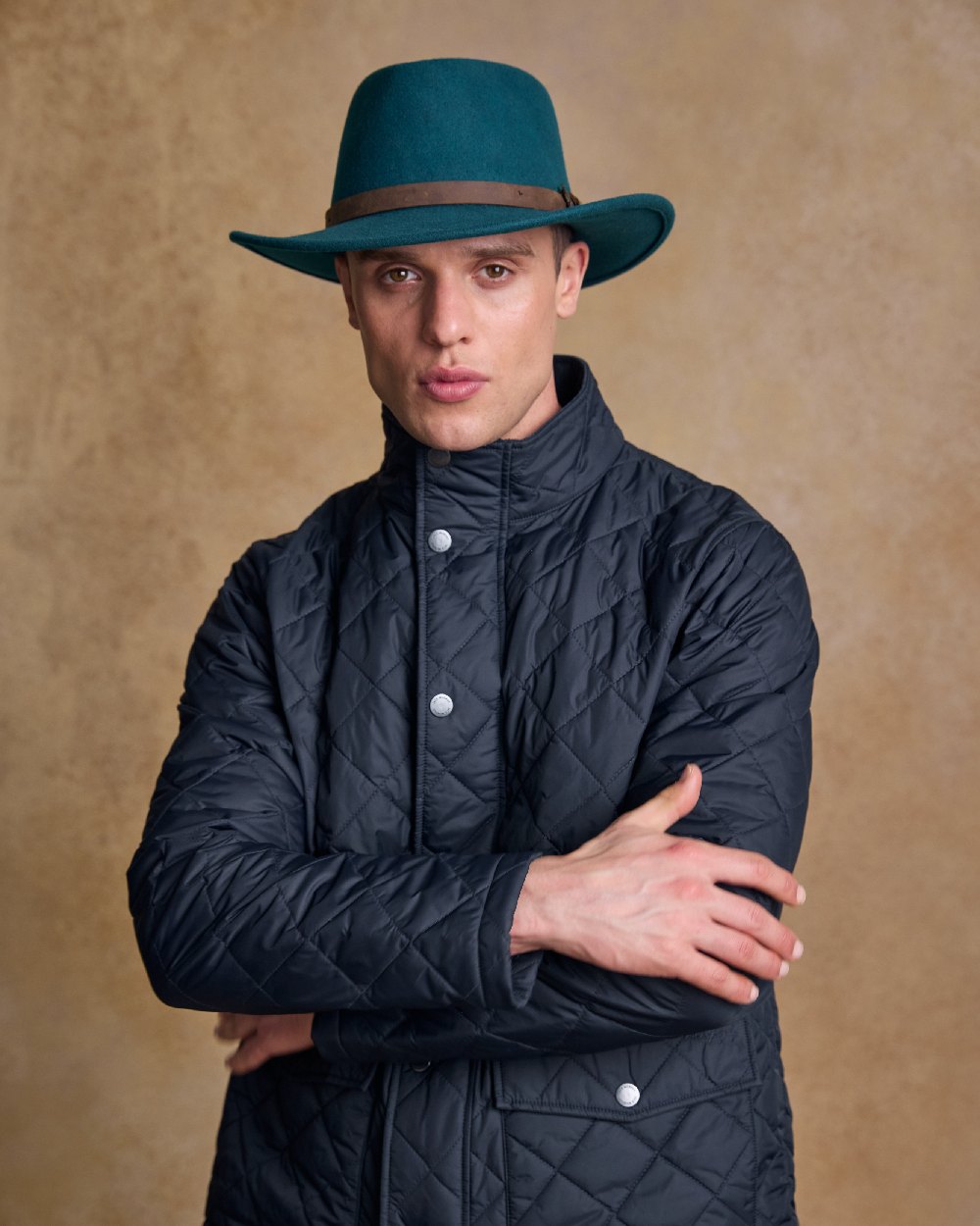 Teal Green Coloured Jack Murphy Boston Crushable Felt Hat on indoor background 