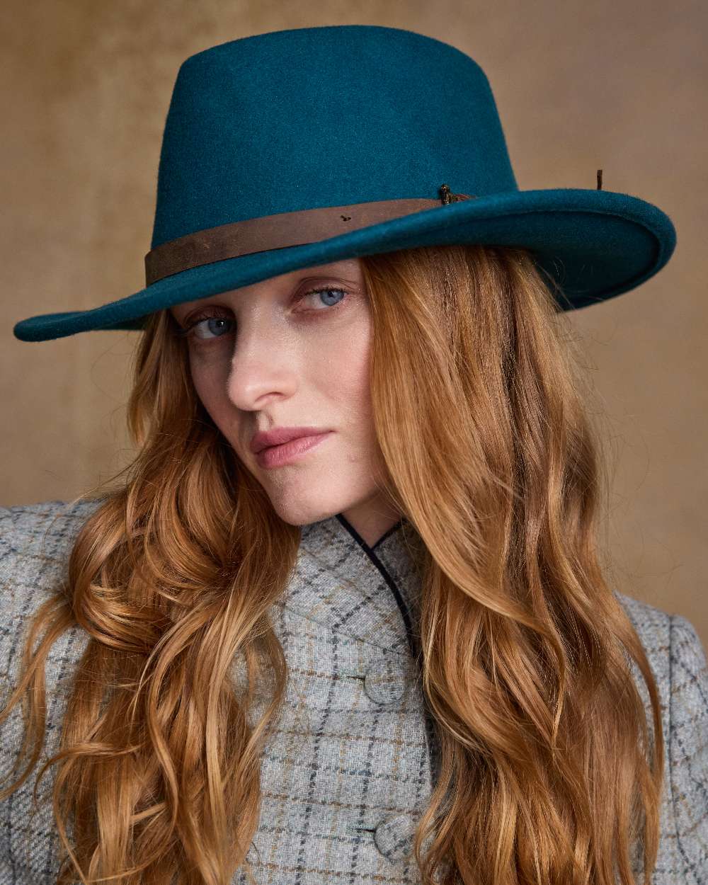 Teal Green Coloured Jack Murphy Boston Crushable Felt Hat on indoor background 