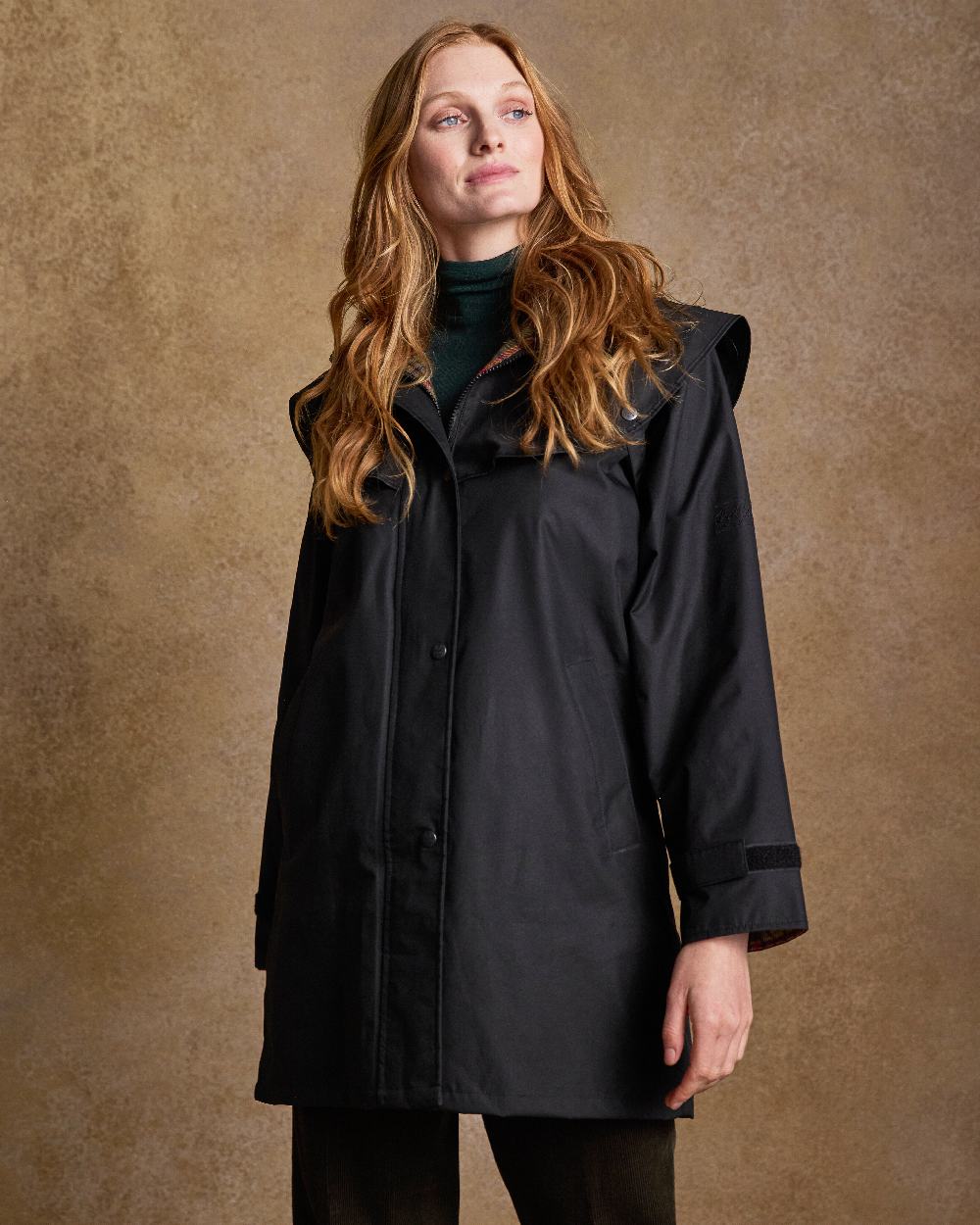 Black Coloured Jack Murphy Cotswold Ladies Waterproof 3/4 Coat on indoor background 