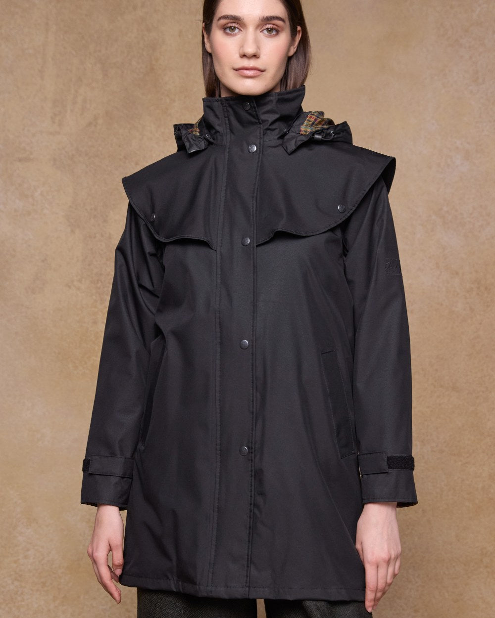 Black Coloured Jack Murphy Cotswold Ladies Waterproof 3/4 Coat on indoor background 