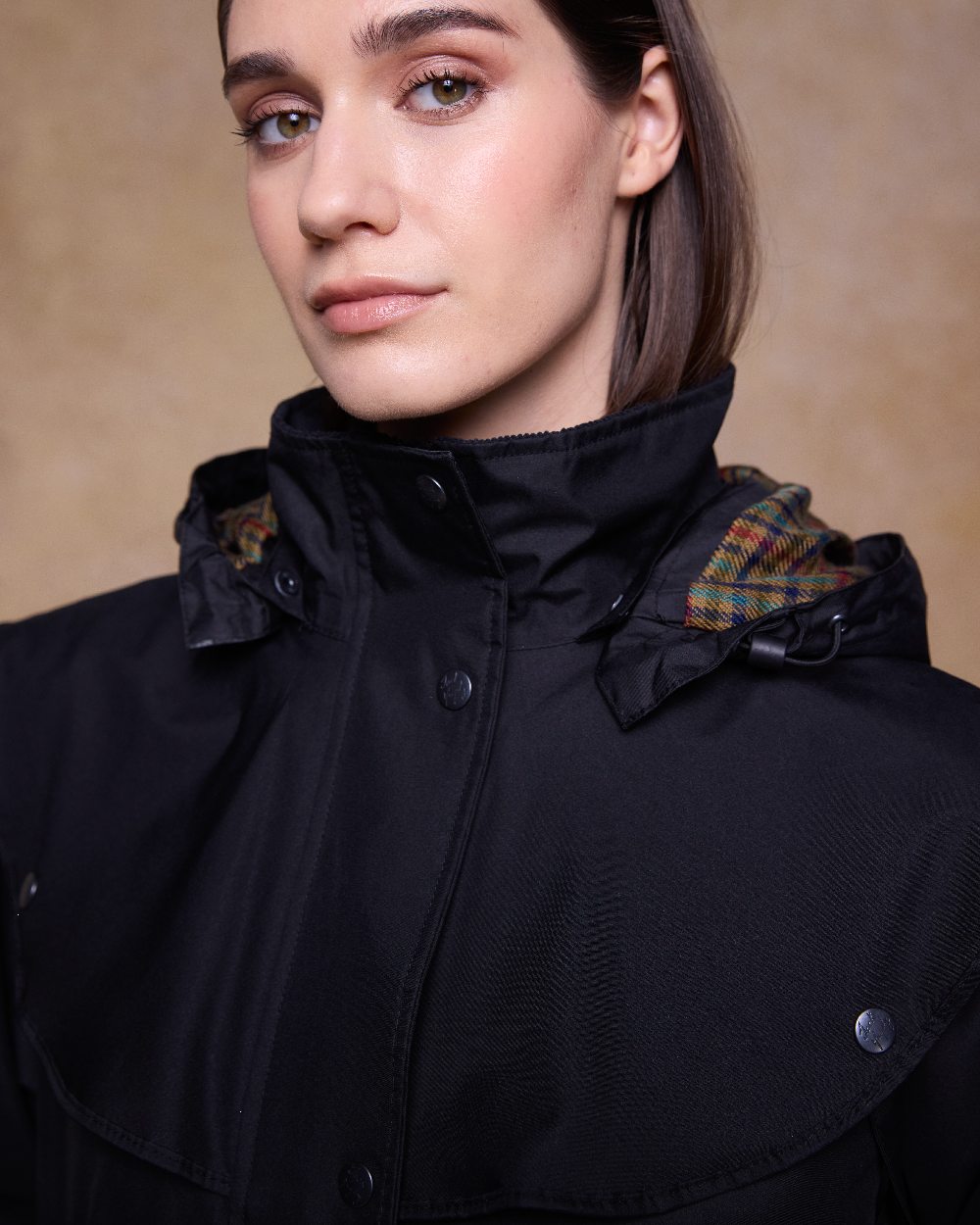 Black Coloured Jack Murphy Cotswold Ladies Waterproof 3/4 Coat on indoor background 