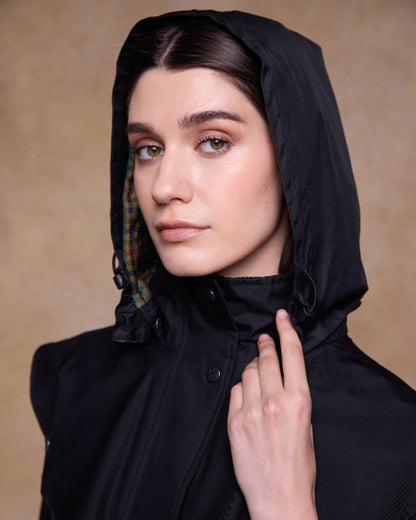 Black Coloured Jack Murphy Cotswold Ladies Waterproof 3/4 Coat on indoor background 