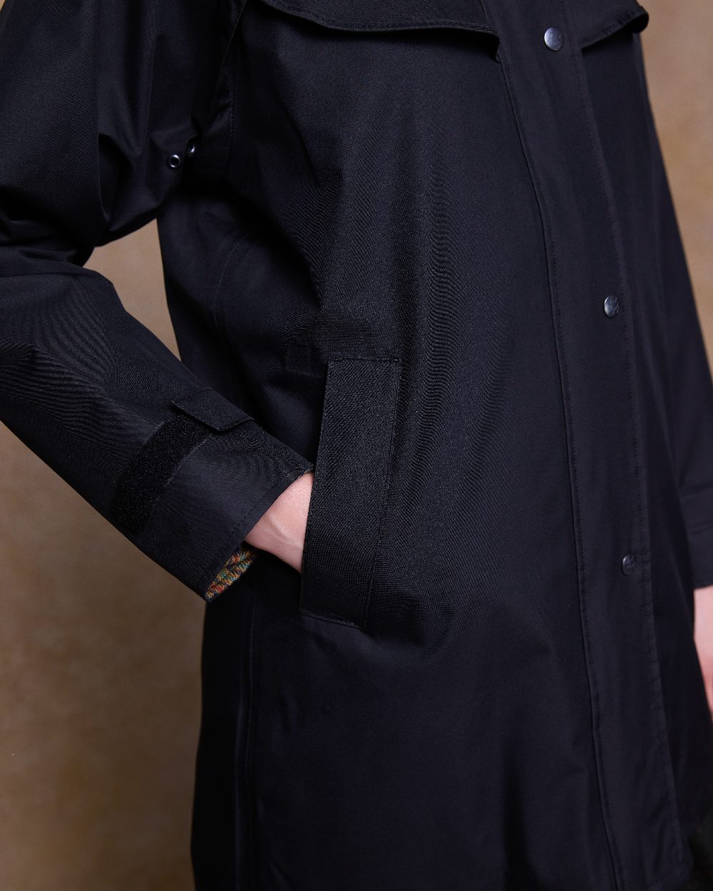 Black Coloured Jack Murphy Cotswold Ladies Waterproof 3/4 Coat on indoor background 
