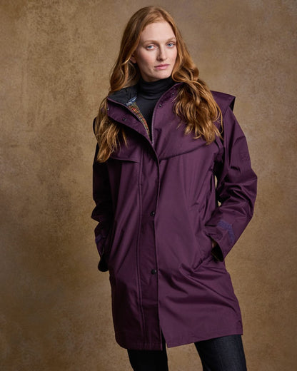 Blackberry Coloured Jack Murphy Cotswold Ladies Waterproof 3/4 Coat on indoor background 