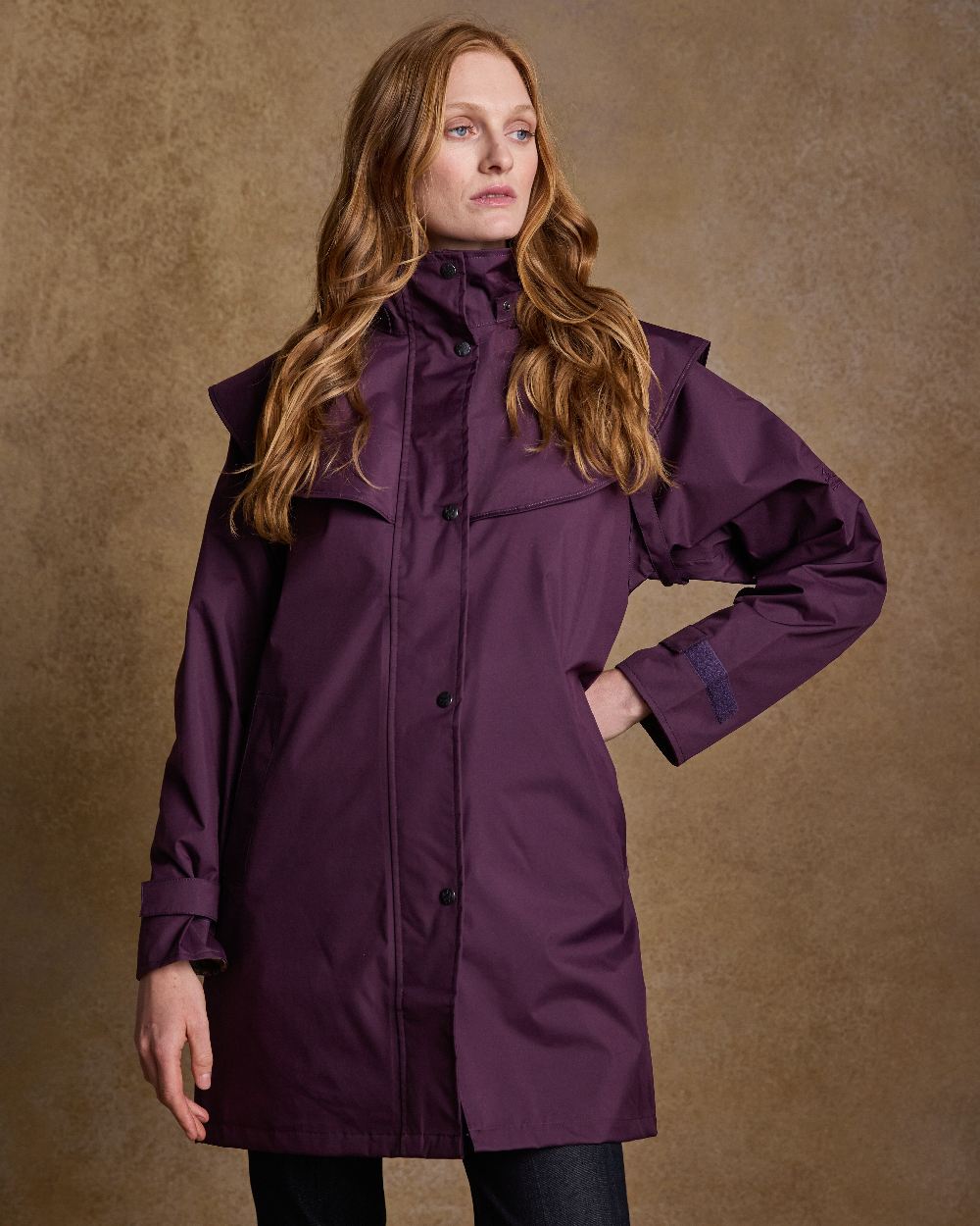 Blackberry Coloured Jack Murphy Cotswold Ladies Waterproof 3/4 Coat on indoor background 