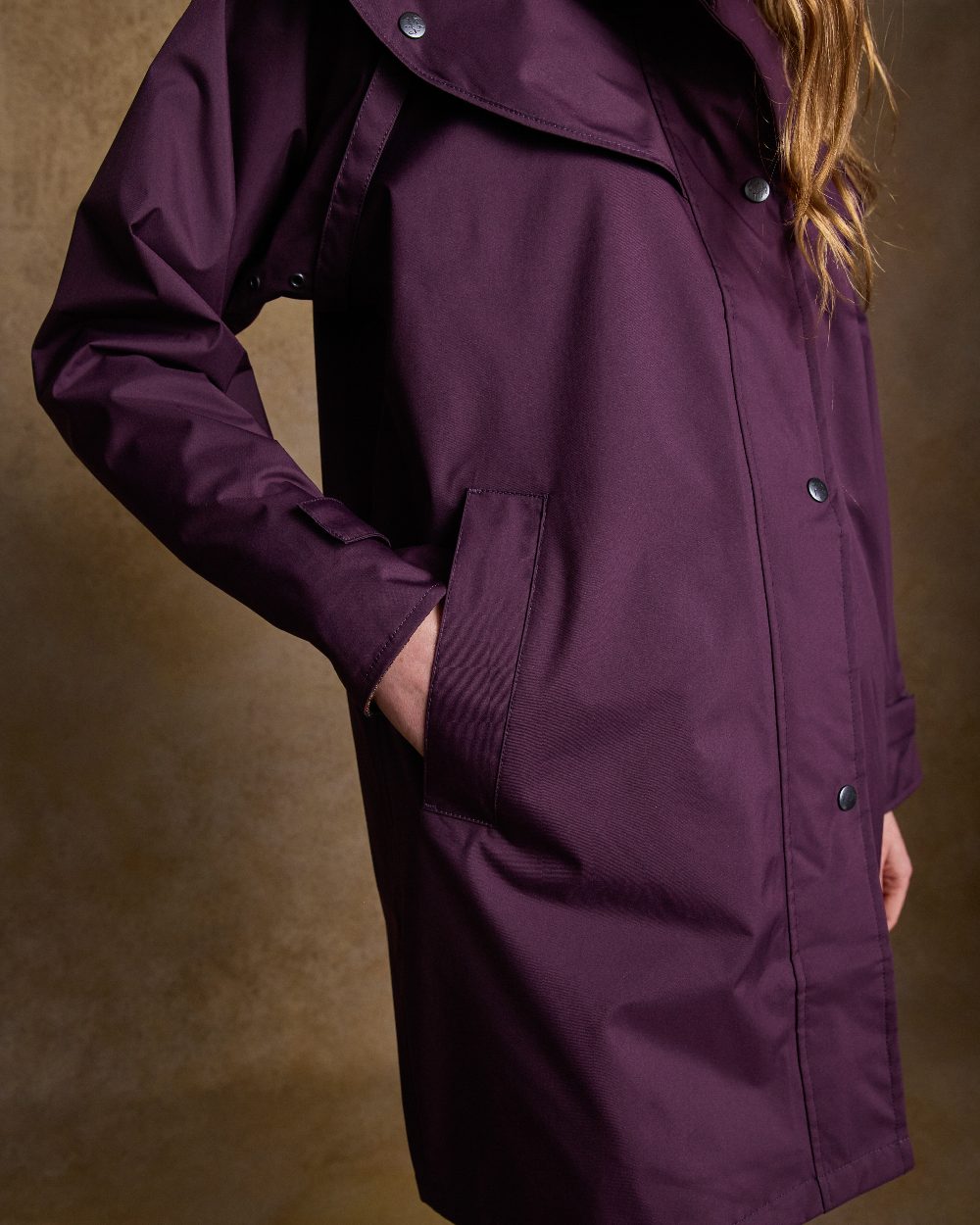 Blackberry Coloured Jack Murphy Cotswold Ladies Waterproof 3/4 Coat on indoor background 