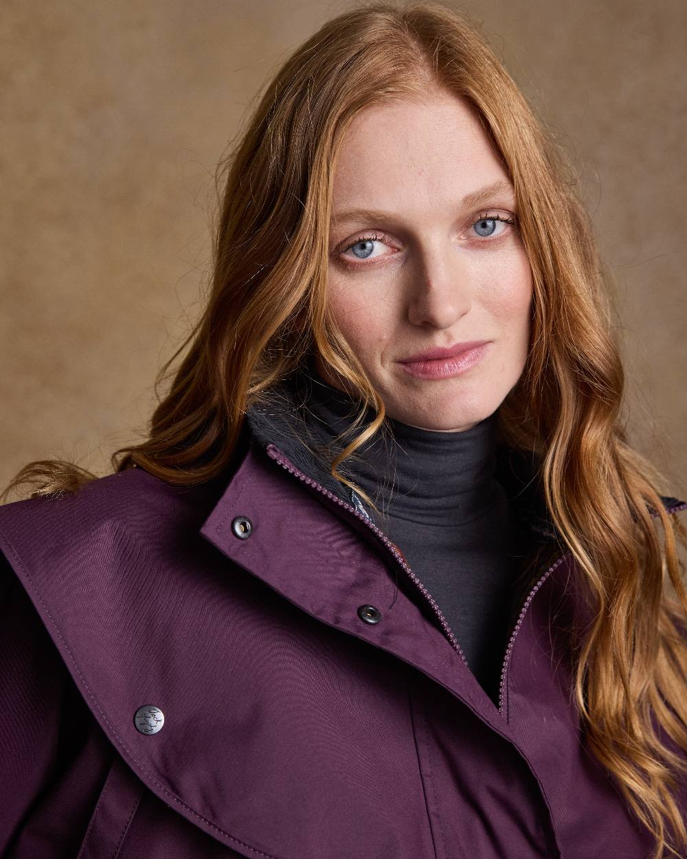 Blackberry Coloured Jack Murphy Cotswold Ladies Waterproof 3/4 Coat on indoor background 