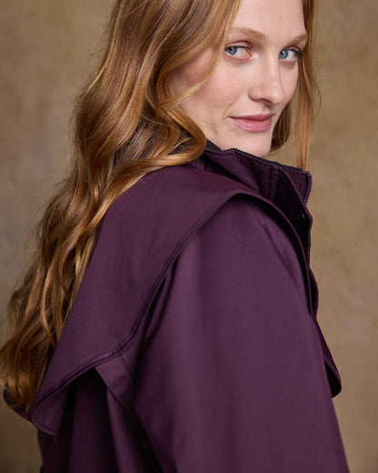 Blackberry Coloured Jack Murphy Cotswold Ladies Waterproof 3/4 Coat on indoor background 