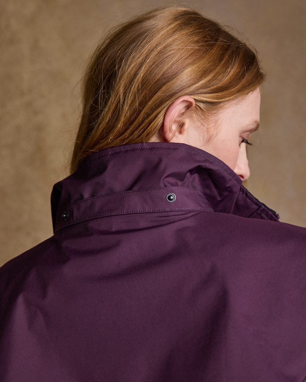 Blackberry Coloured Jack Murphy Cotswold Ladies Waterproof 3/4 Coat on indoor background 