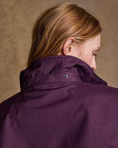 Blackberry Coloured Jack Murphy Cotswold Ladies Waterproof 3/4 Coat on indoor background 