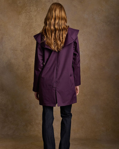 Blackberry Coloured Jack Murphy Cotswold Ladies Waterproof 3/4 Coat on indoor background 