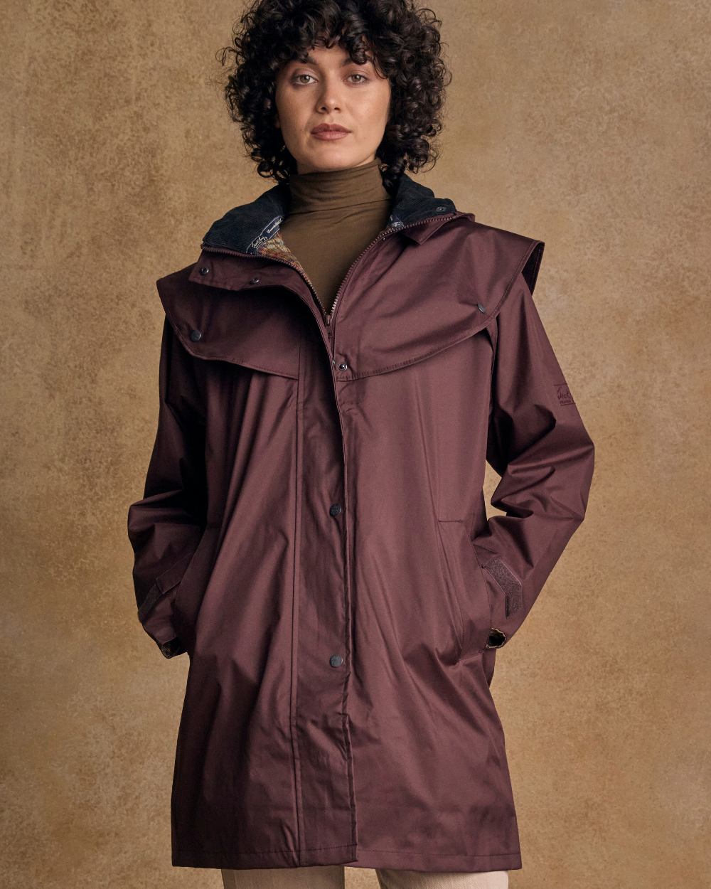 Deep Claret Coloured Jack Murphy Cotswold Ladies Waterproof 3/4 Coat on indoor background 