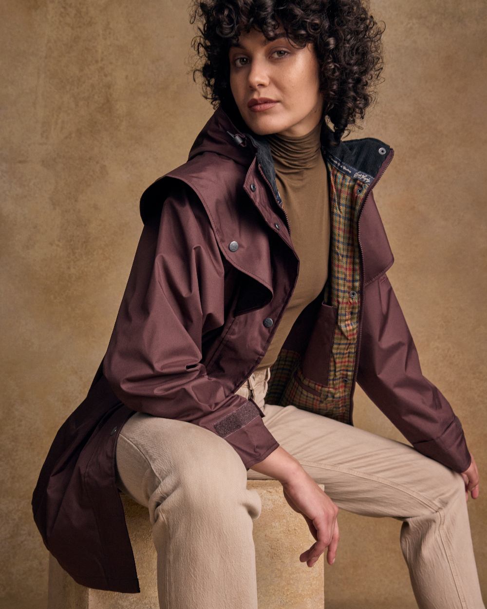 Deep Claret Coloured Jack Murphy Cotswold Ladies Waterproof 3/4 Coat on indoor background 