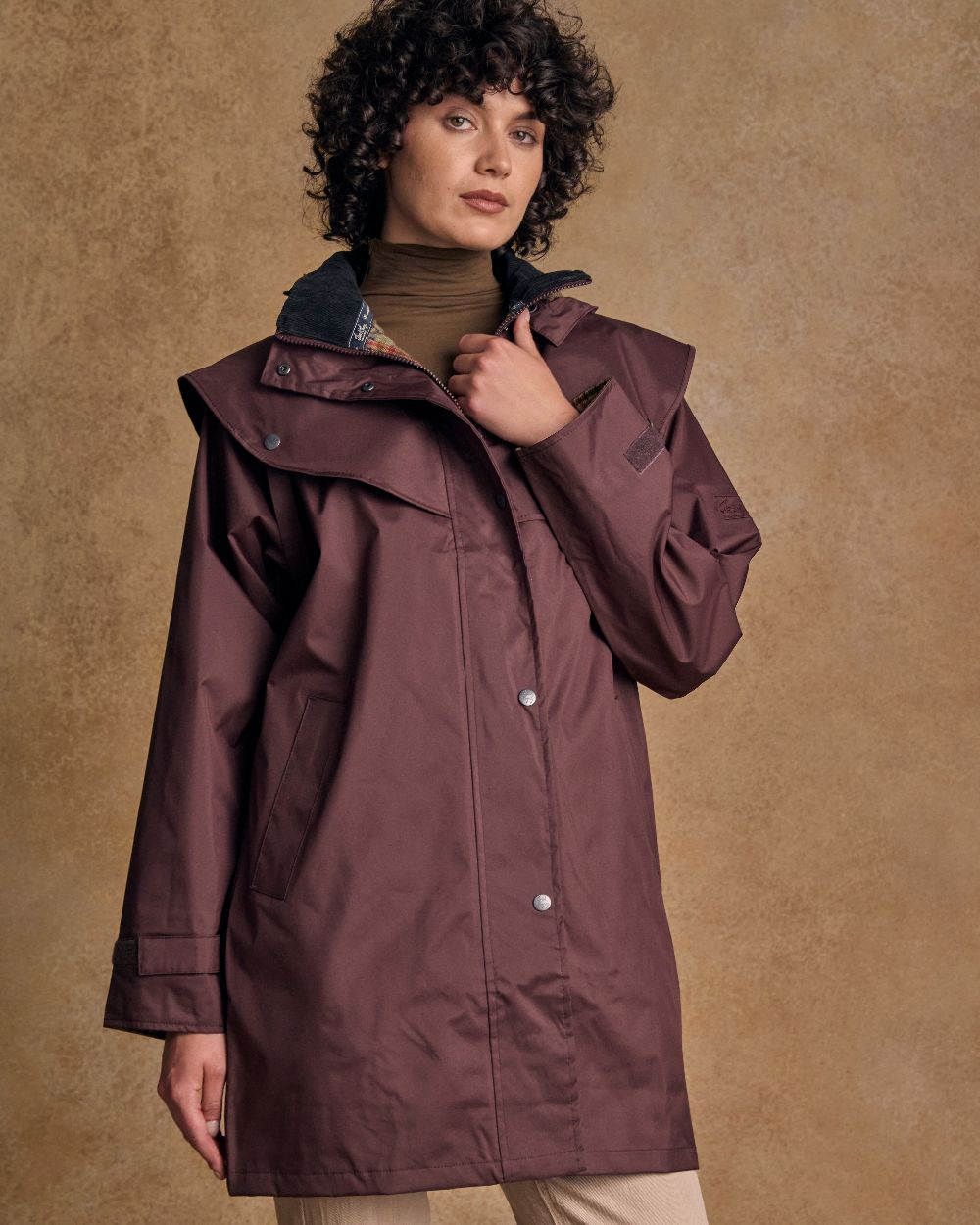 Deep Claret Coloured Jack Murphy Cotswold Ladies Waterproof 3/4 Coat on indoor background 