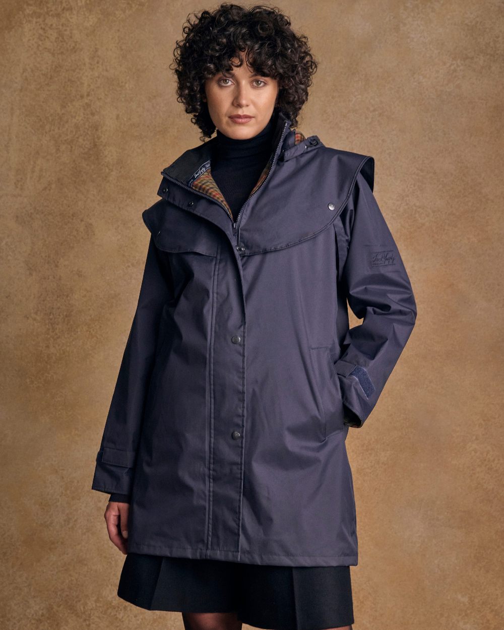 Heritage Navy Coloured Jack Murphy Cotswold Ladies Waterproof 3/4 Coat on indoor background 