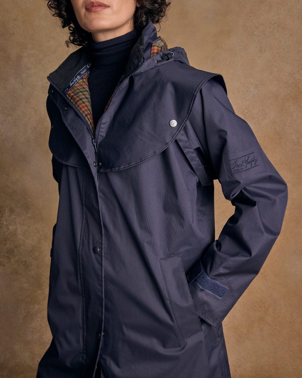 Heritage Navy Coloured Jack Murphy Cotswold Ladies Waterproof 3/4 Coat on indoor background 