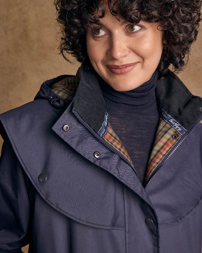 Heritage Navy Coloured Jack Murphy Cotswold Ladies Waterproof 3/4 Coat on indoor background 