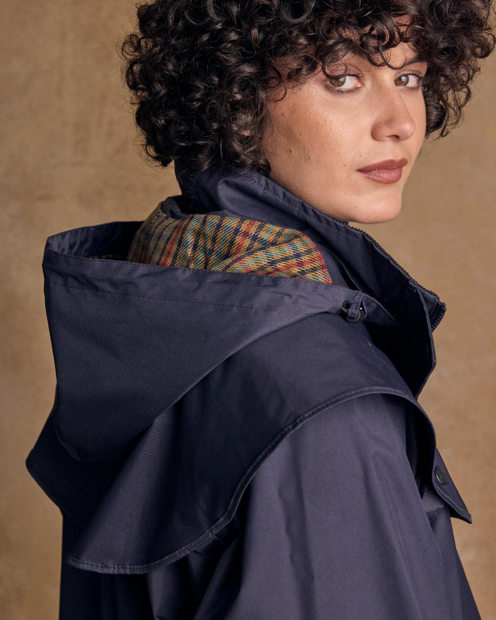 Heritage Navy Coloured Jack Murphy Cotswold Ladies Waterproof 3/4 Coat on indoor background 